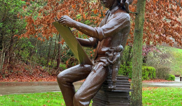 Herge statue along with Tintin and Snowy at Louvain-la-Neuve 